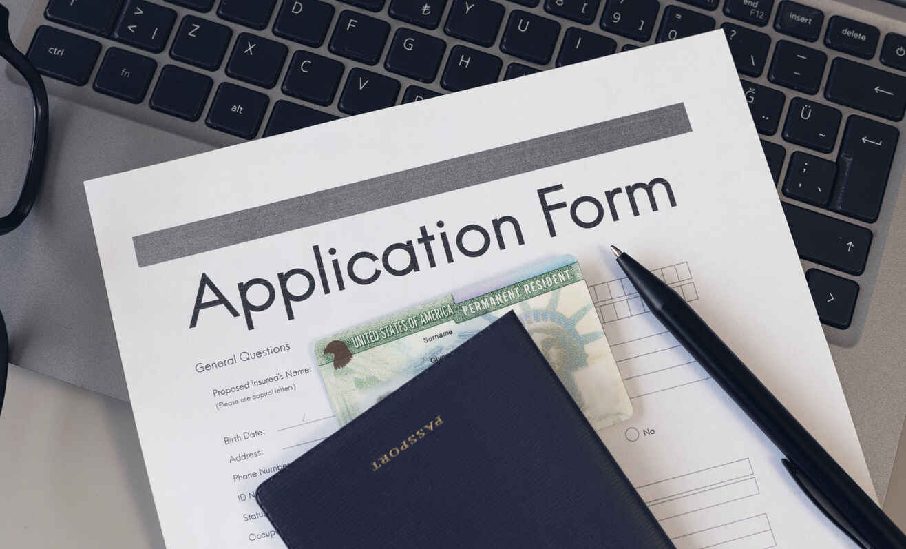 Green card application form and passport.